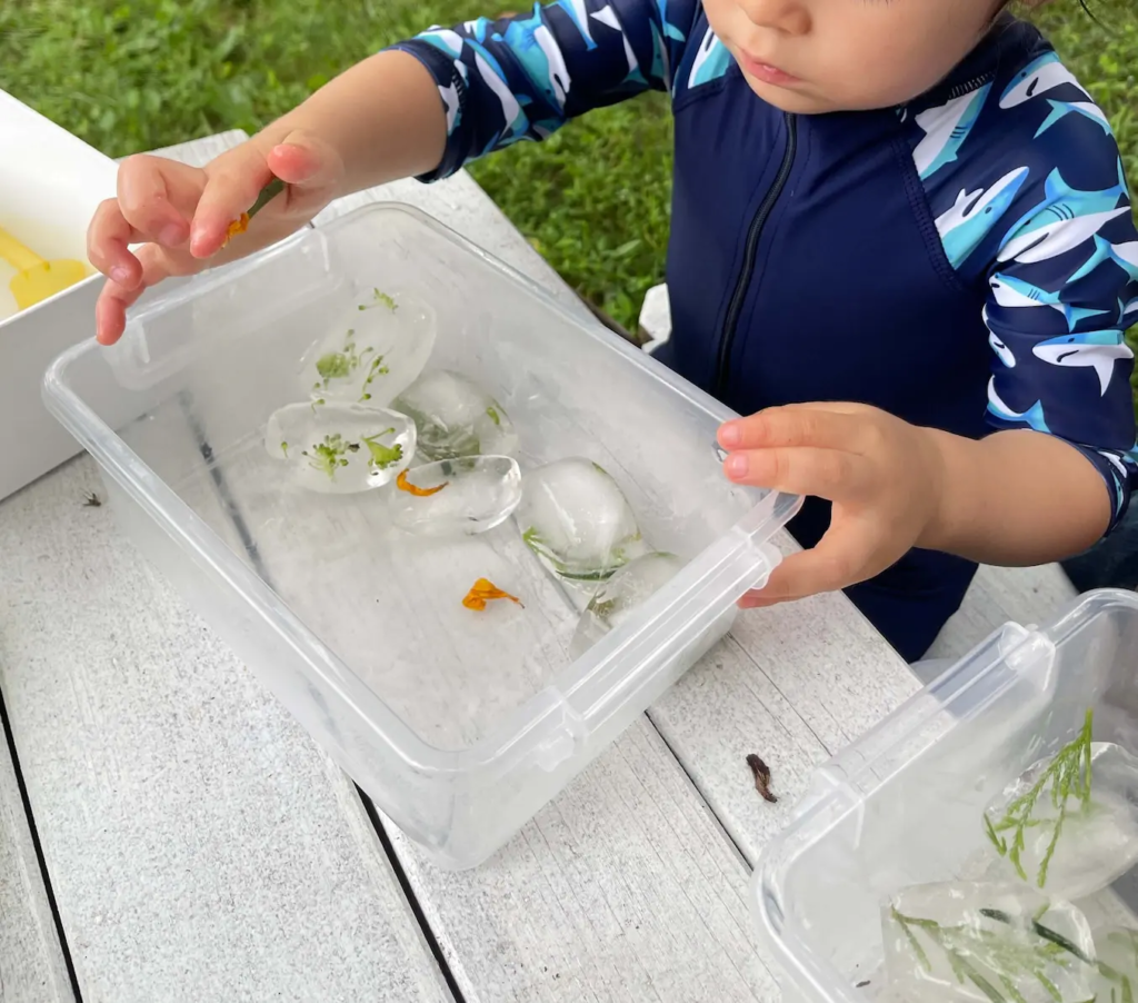 Boy focused on building a recycled-materials craft